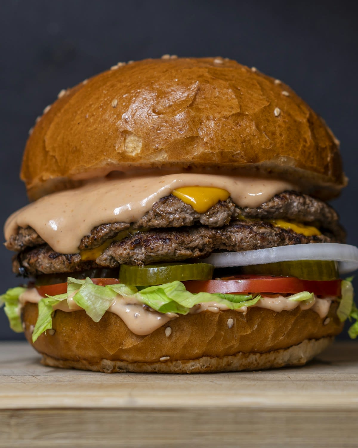 Smash burger with melted cheese on a sesame bun