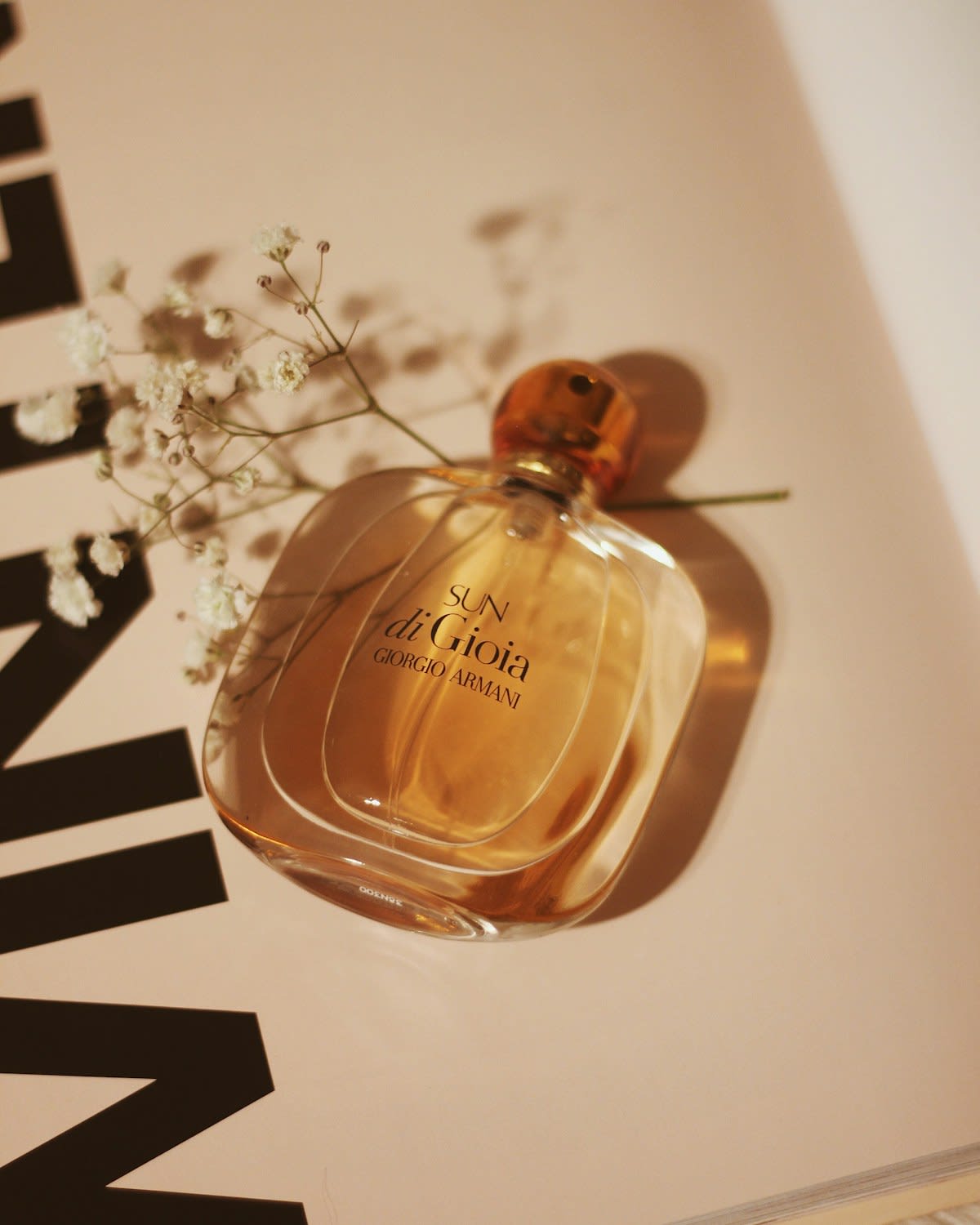 Amber glass perfume bottle in soft light