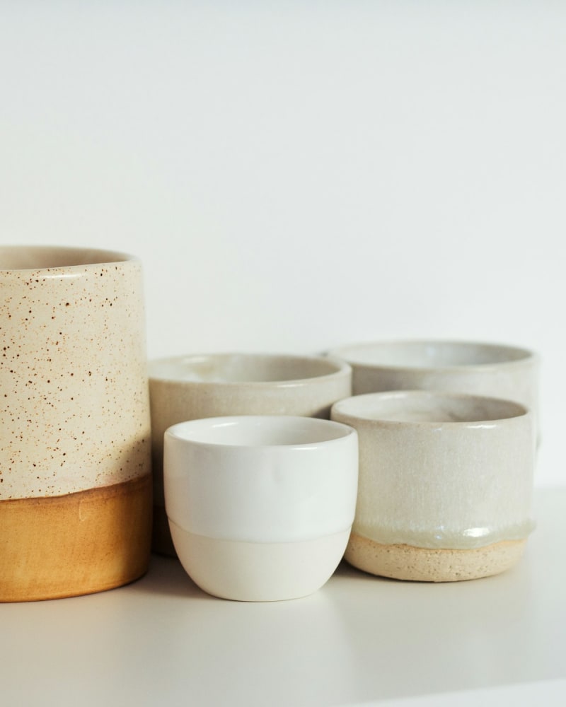 Ceramic bowls on a coloured backdrop