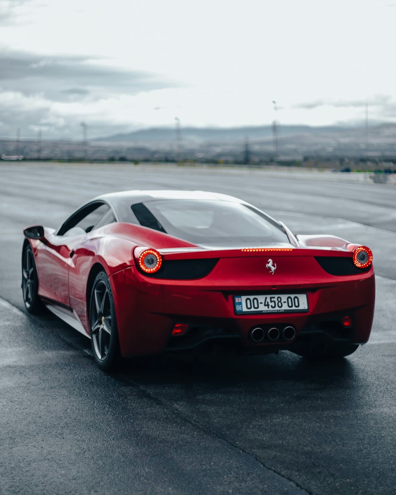 Red sports car on a mountain road